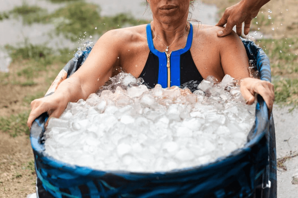 woman sitting in ice bath