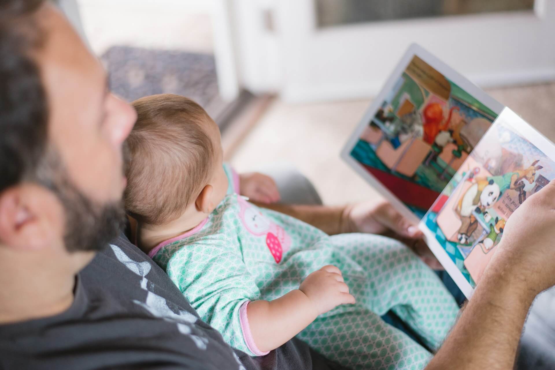 a dad reading to his child