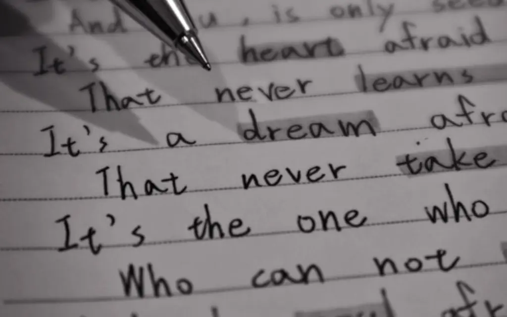 pen making notes in notebook