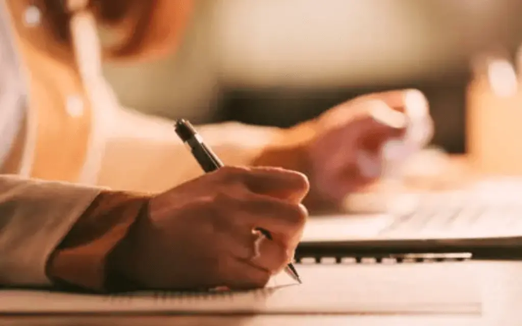 making notes in notebook